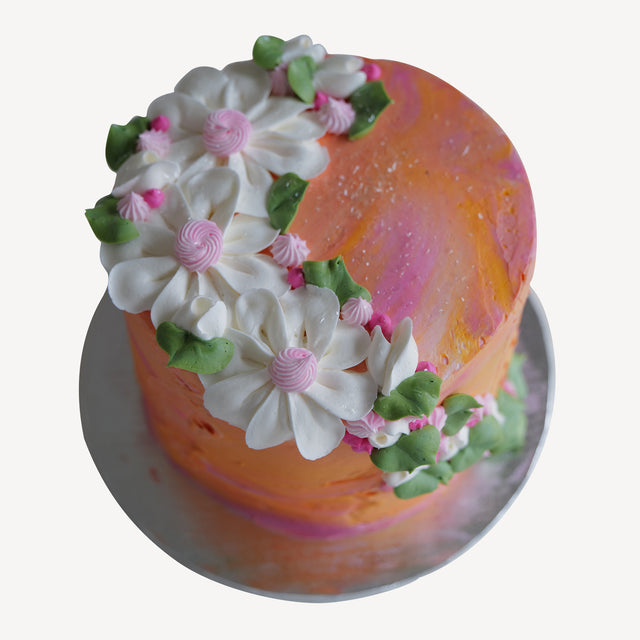 Online Cake  Order - Orange Stucco with White Flowers #115Featured
